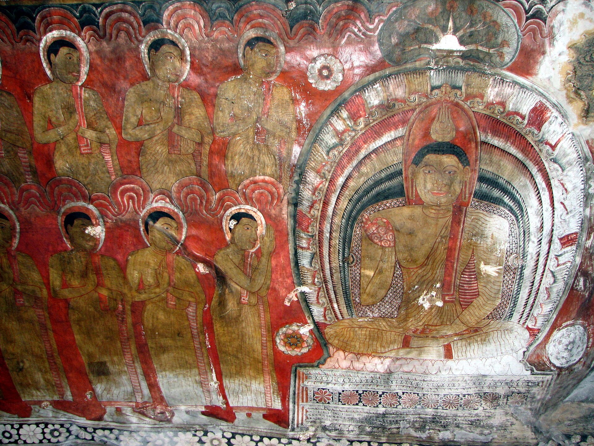 Painted Buddha figures covering the rock ceiling of a Dambulla cave temple