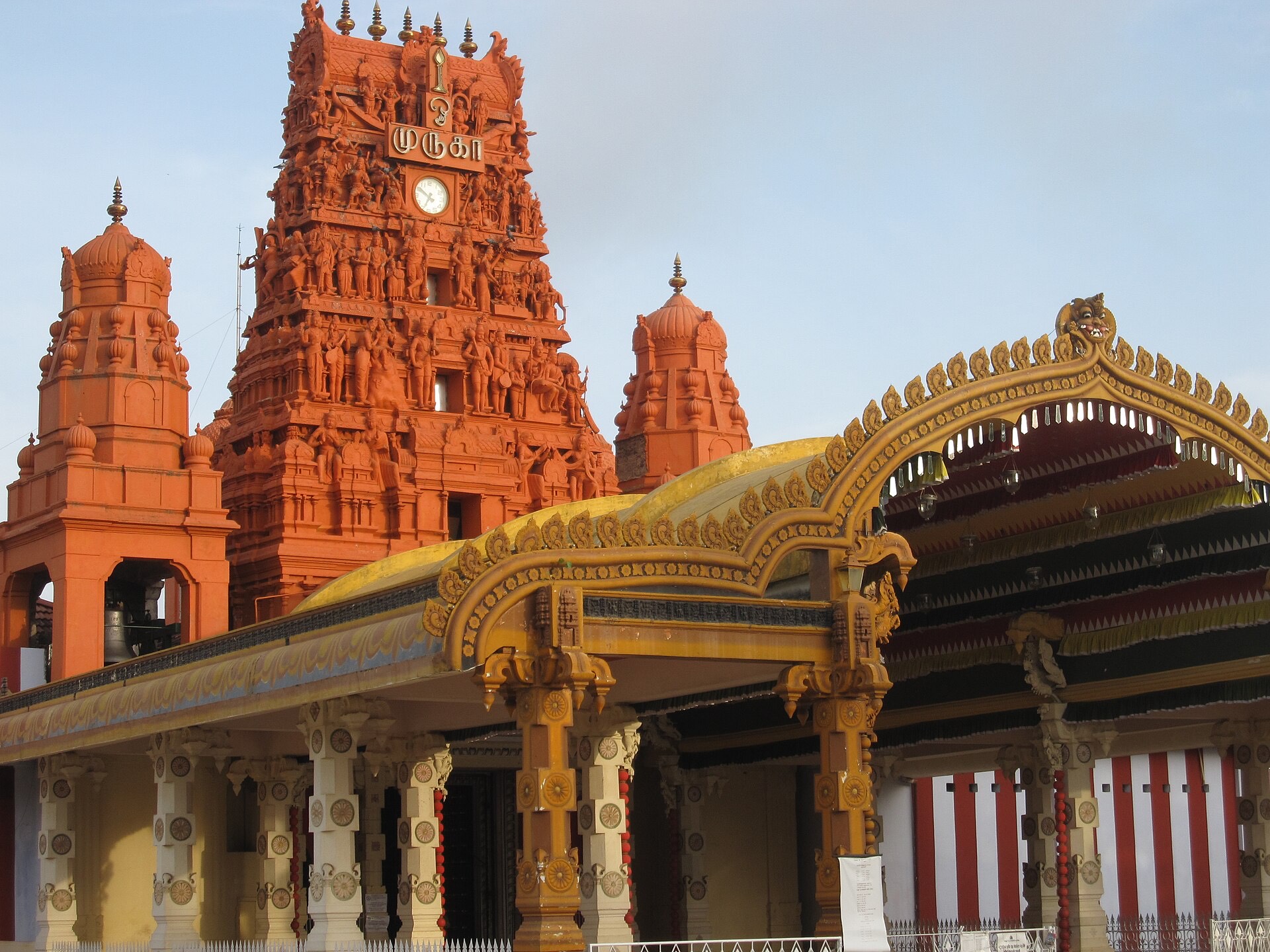 The golden-red tower and gateway of Nallur Kandaswamy Kovil in Jaffna