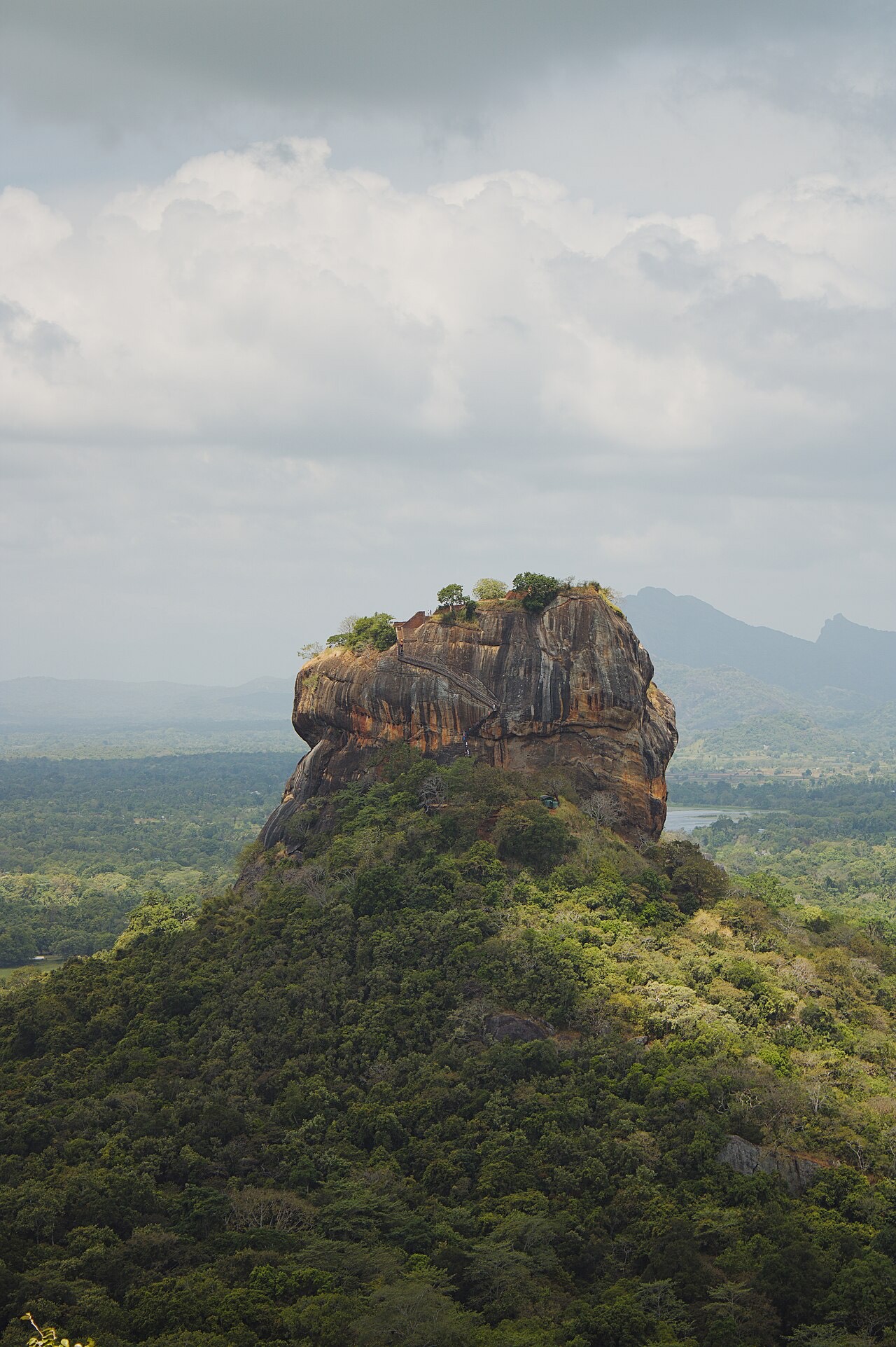 Sigiriya rock seen from the top of Pidurangala, above the forest